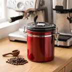 Stainless steel coffee bean canister with CO2 valve and date dial on an oak home coffee station