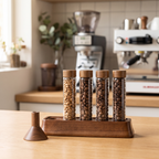 Single dose coffee bean tubes in magnetic display stand on a home coffee station